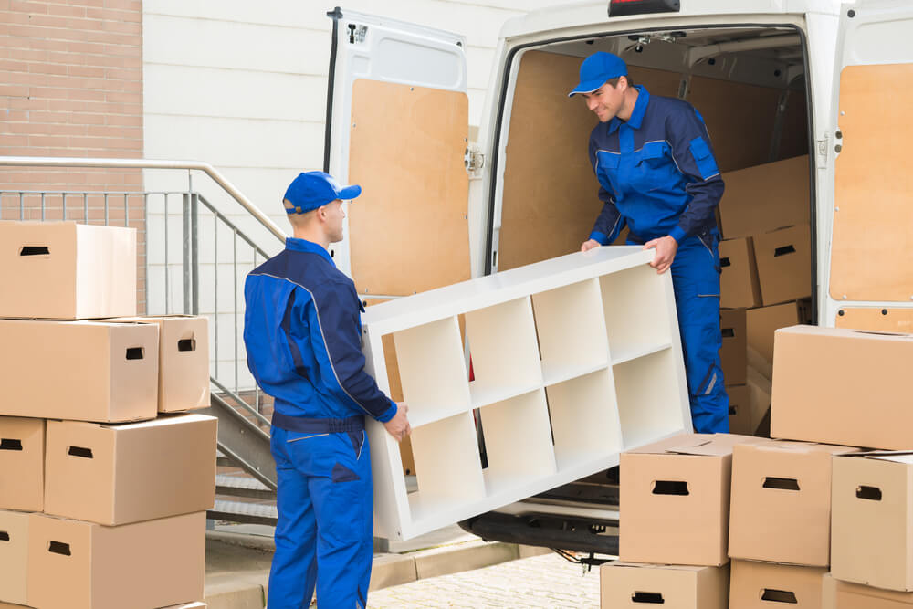 Movers Loading Boxes Into A Truck Key Largo